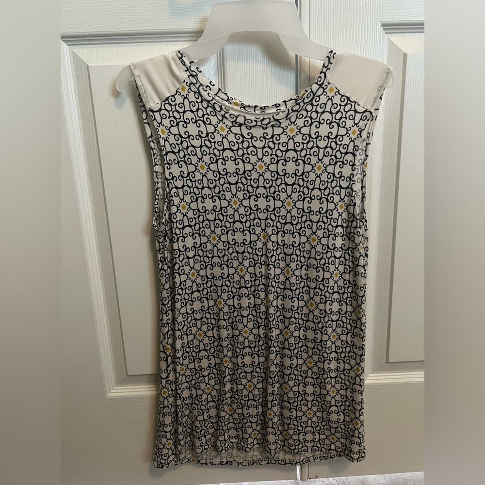 Off white women’s top with design of black and yellow. Size MEDIUM lightly used